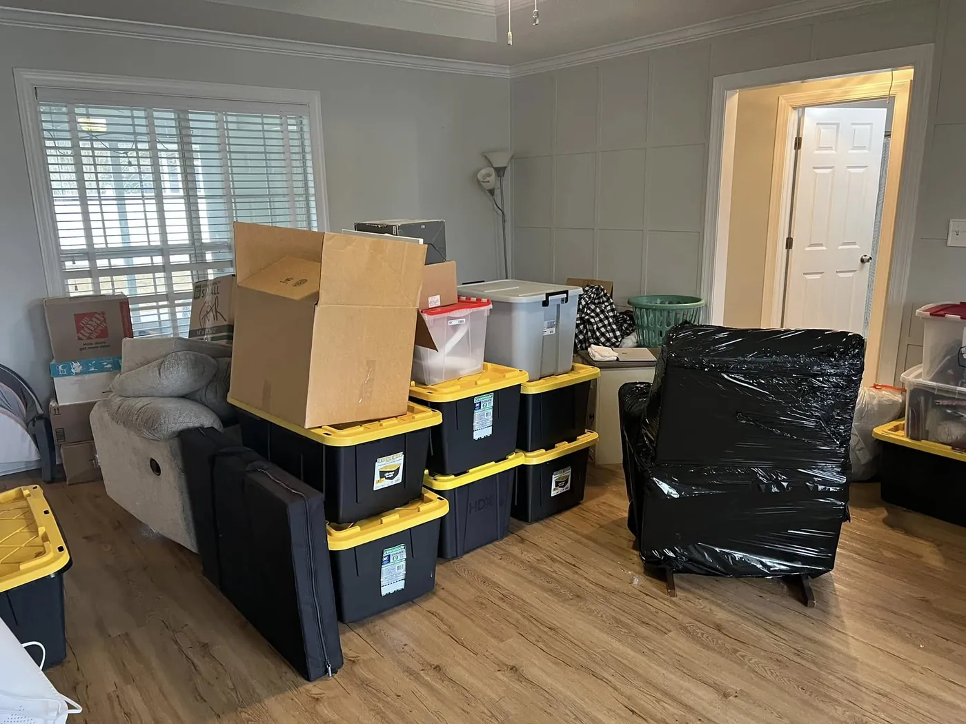 Boxes neatly stacked in a freshly delivered Valdosta, GA living room